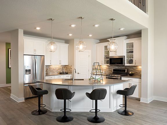 It s easy to converse with family and guests while you re cooking in the open gourmet kitchen.