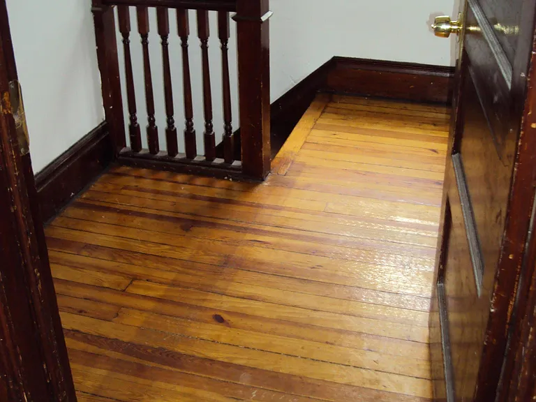 private upper landing at the end of the private stair case - perfect for changing into outside/home gear (carpet has been removed)