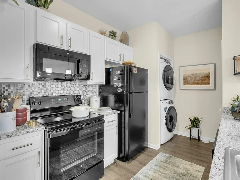 Enjoy a modern and spacious student apartment with a fully equipped kitchen and comfortable living space at The Flatts Starkville near MSU.