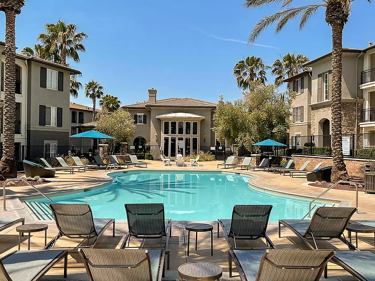 Outdoor Pool Surrounded by Cabanas and Relaxation Areas