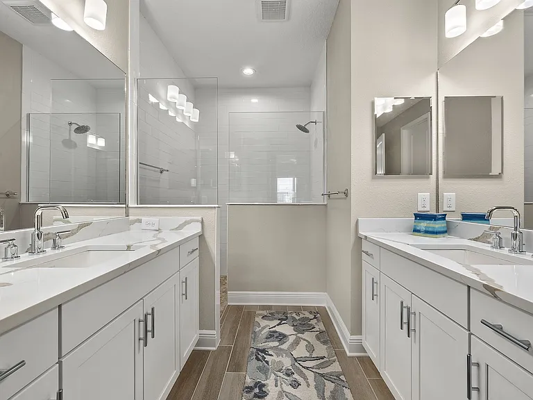 Primary Bath features his & her vanities & sinks.