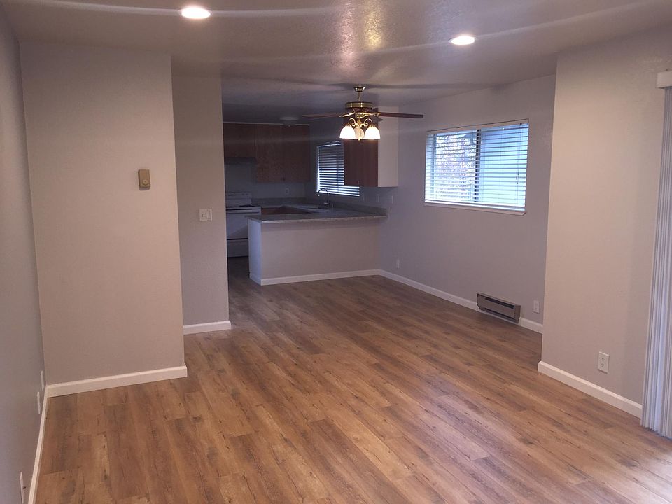 Living room with balcony, dining room and kitchen