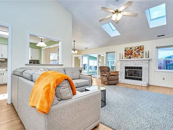 Open living area with cathedral ceiling