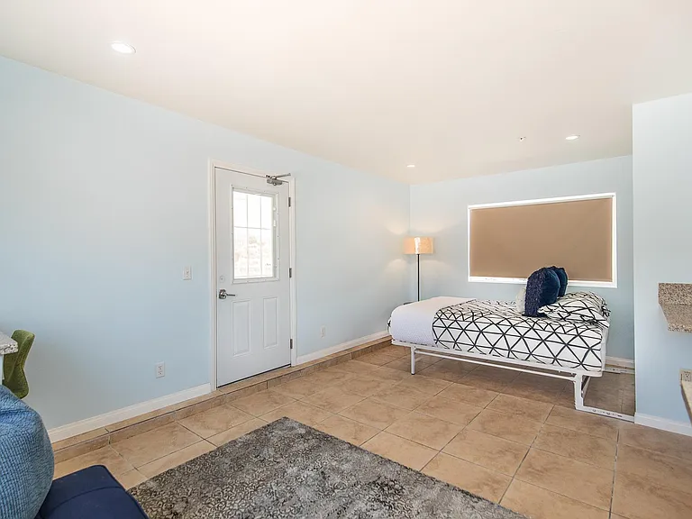 Downstairs guest room with queen wall bed down