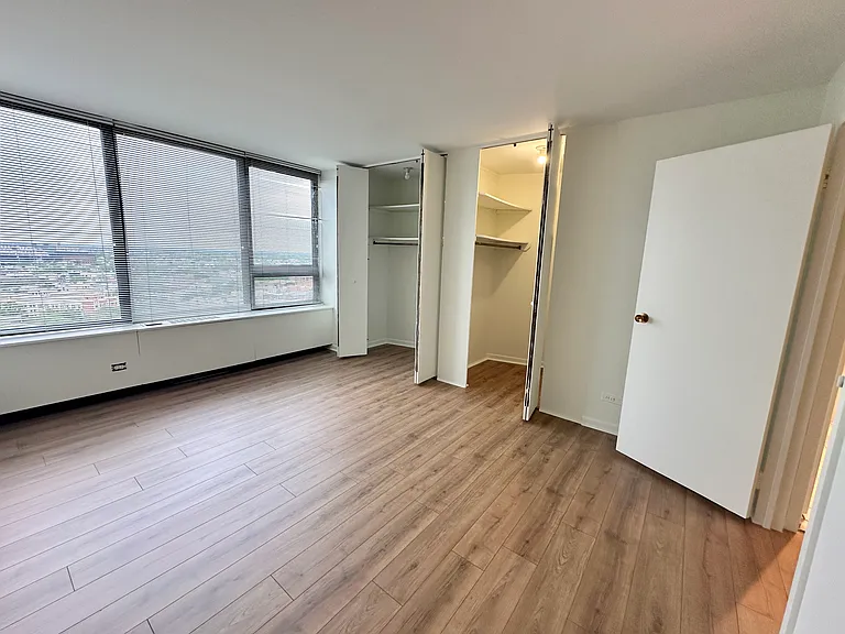 Bedroom with views of Wrigley Field. 2 closets.