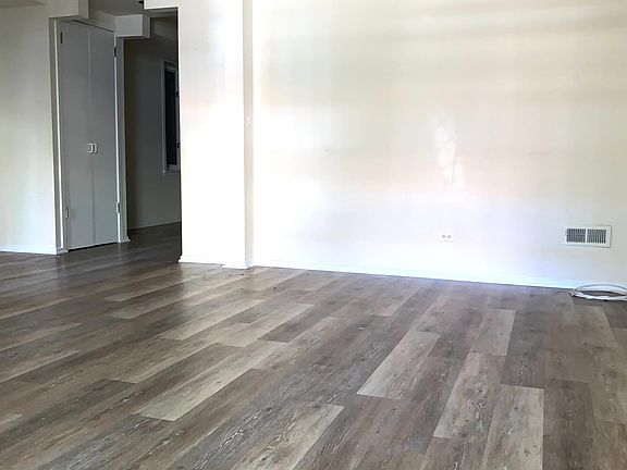 Living room (showing hall to dining area/kitchen)