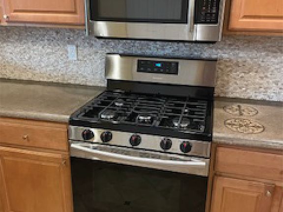Stainless steel gas range and microwave