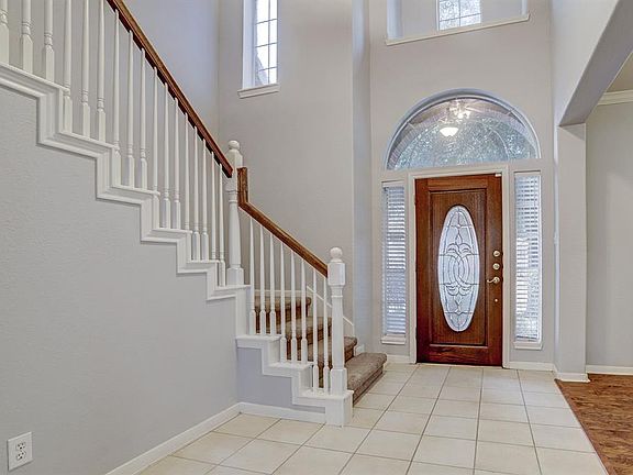 Beautiful and welcoming two story entrance.
