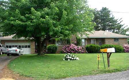 Solidly built stone house with garage and large level yard