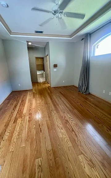 Primary bedroom with private entrance space, dual doors, walk in closet, linen closet, and pocketing sliding doors onto the lanai. A renter's dream of life!! Blinds and black out curtains for convenience only.