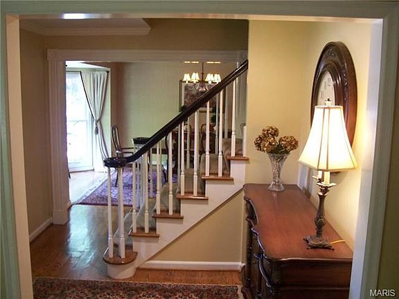 welcoming foyer with view to dining room with added bay