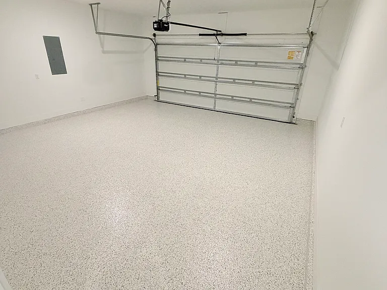 Clean 2-car garage with ample parking and storage space