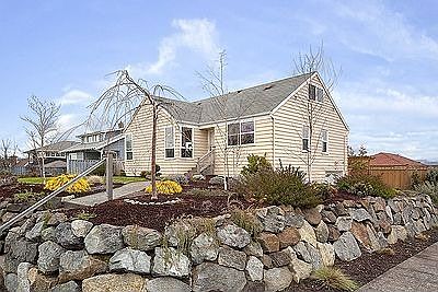 Great curb appeal from this corner lot home with tons of natural light.