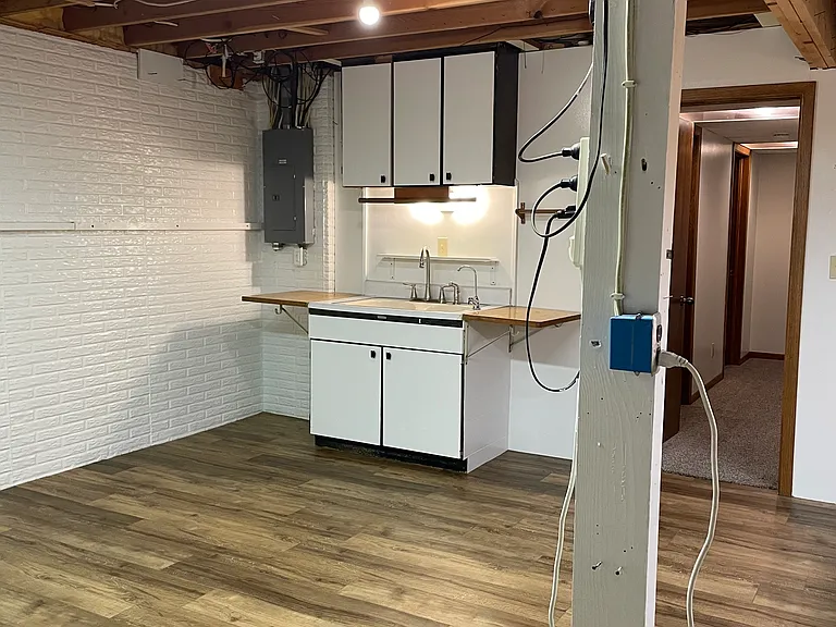 Basement bonus room. Would make a great workout room or workshop. Sink with hot and cold water