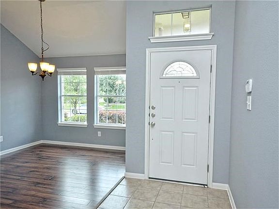 Lovely updates include laminate flooring and fresh interior paint.
