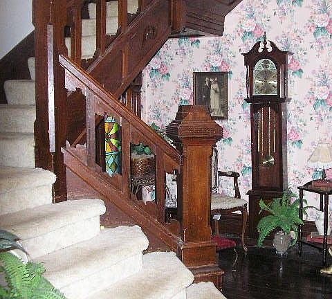 2-STORY FOYER W/ GRAND STAIRCASE & STAINED GLASS WINDOWS