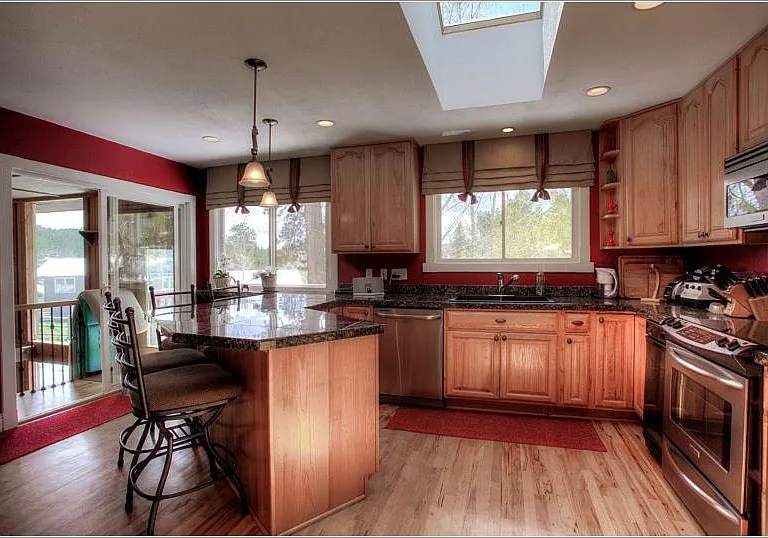Kitchen with Cherry Cabinetry and Stainless Appliances