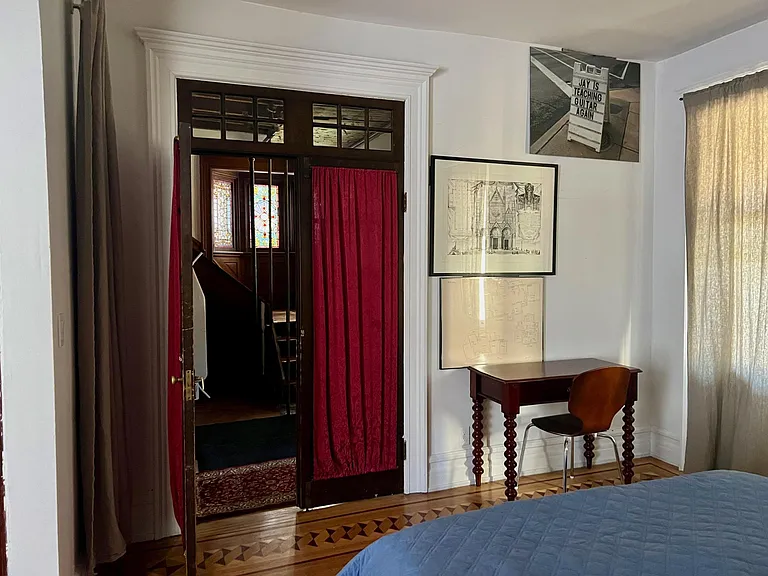 Exit to the entryway from living room (now set up as a bedroom).