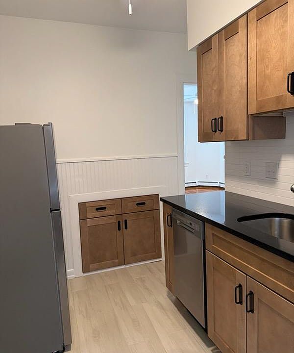NEWLY remodeled Kitchen with Stainless Steel Appliances, including Refrigerator, Stove w. Glass Cooktop; Exhaust Hood; Garbage Disposal & Dishwasher.