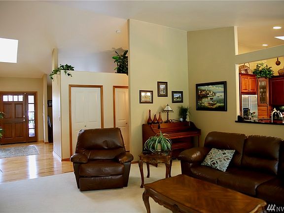 The attention to detail shows in the hardwood floors, wood trim around the doors and the vaulted ceilings.