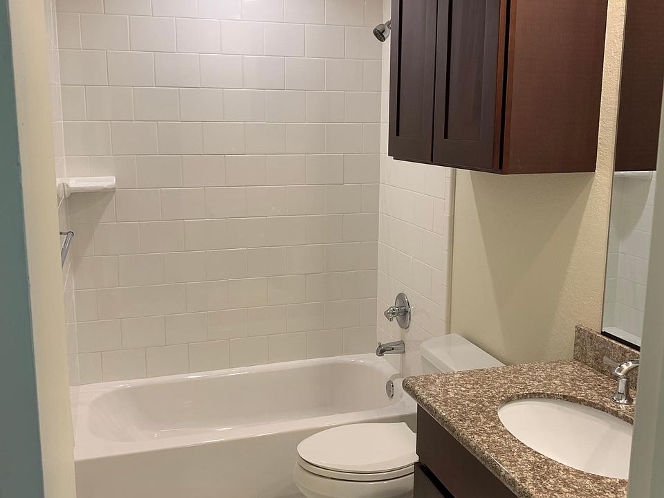 spotless bathroom, new cabinets, granite counters, tile