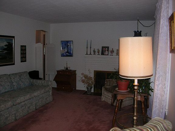 Fireplaced Living Room with hardwood flooring