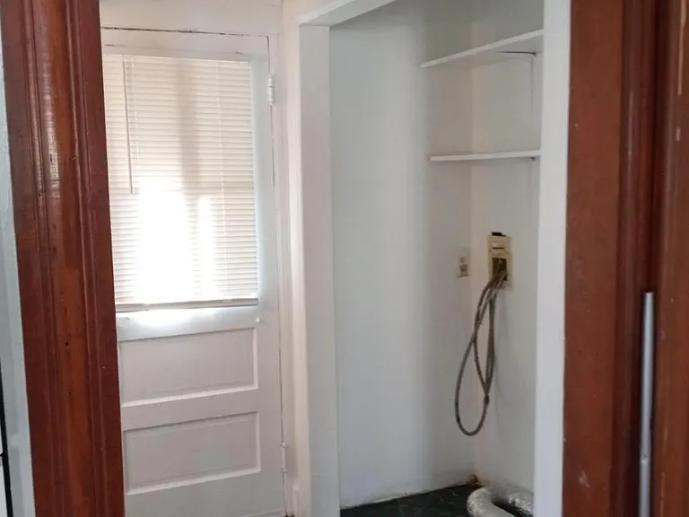 Back Hall closet with Laundry hook ups