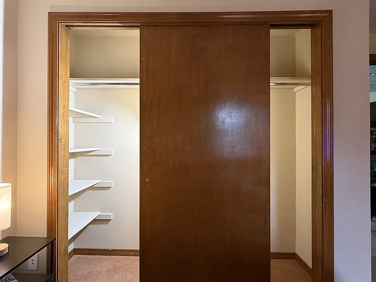 Room 1 large two-door closet with built-in shelving