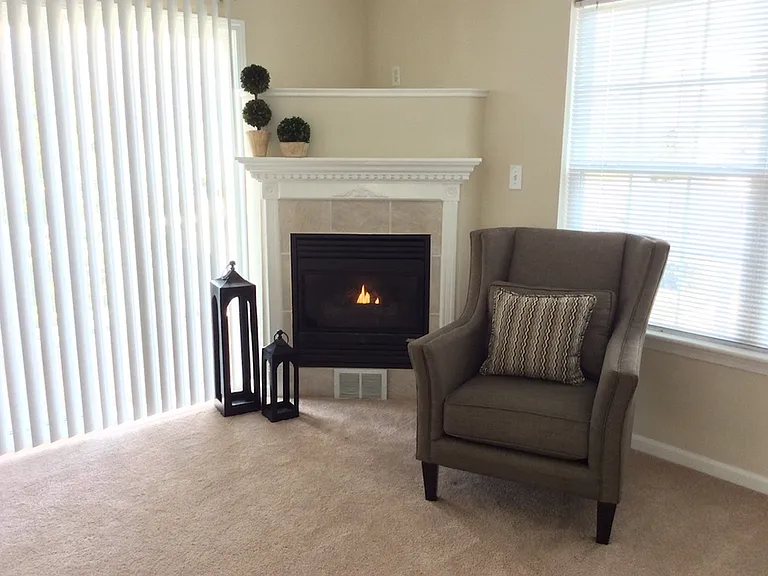 Living Room with Cozy Fireplace (Available in Many Homes)