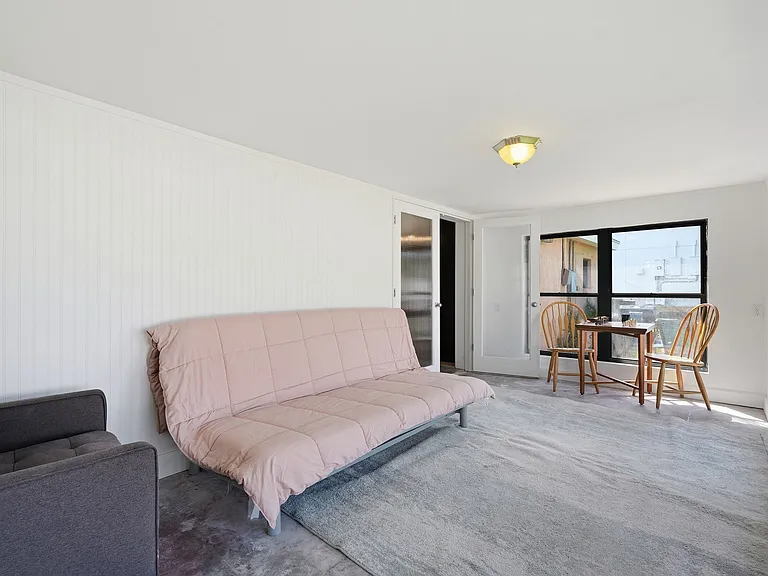 Florida room has recliner, full size futon bed, gaming table and optional 50 inch TV.