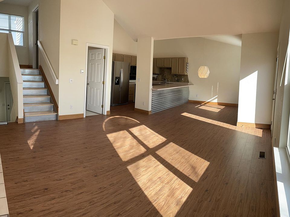 Main floor great room - NEW FLOORS - sunny with tall ceilings and amazing mountain views