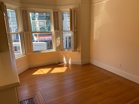 Living Room with Bay windows facing Fillmore Street.