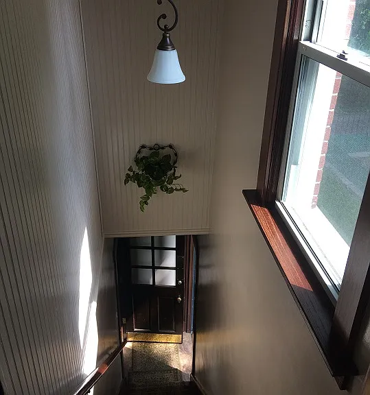 Steps up to apartment.