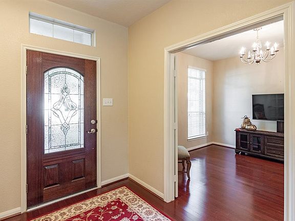 As you enter home, formal dining is to the left. Flexible space can also be TV room, play area, study with elegant French doors for privacy.