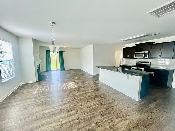 Kitchen, dining area, and living room