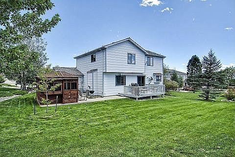 Back of home with 7 person spa