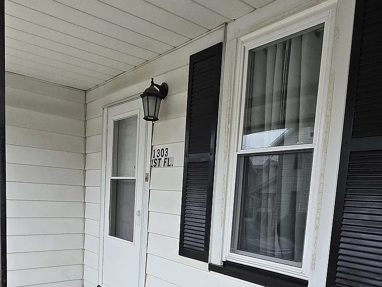Covered porch and entrance to apartment
