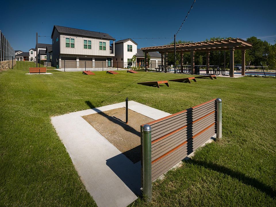 outdoor game area with horseshoe, cornhole, and pickeball