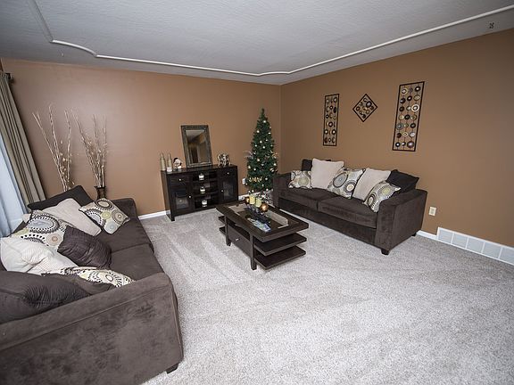 Walk in the front door to the comfortable Living room (16x15) with white trim accent, new carpet and paint.