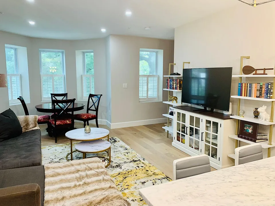 View of living area from kitchen. Shelving can be removed upon request.