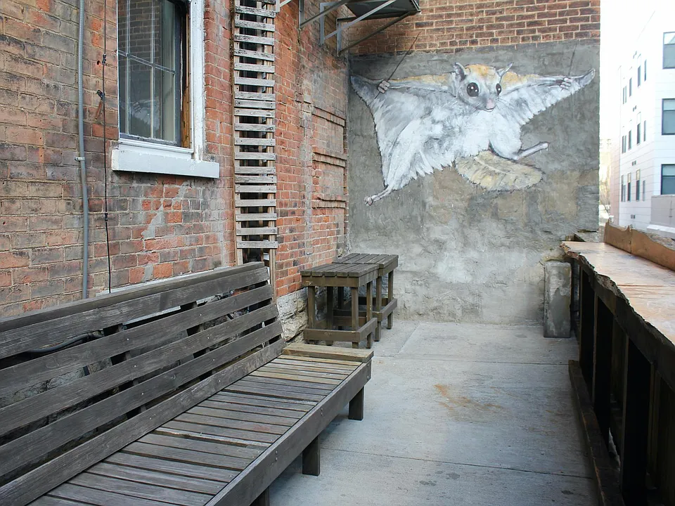 This apartment features a private back patio with a mural by local artist Kyle Penunuri.