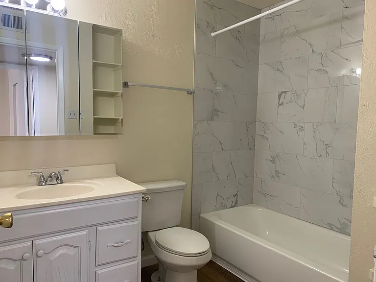 Adorable Fourplex Nestled in Four Hills — Photo 7