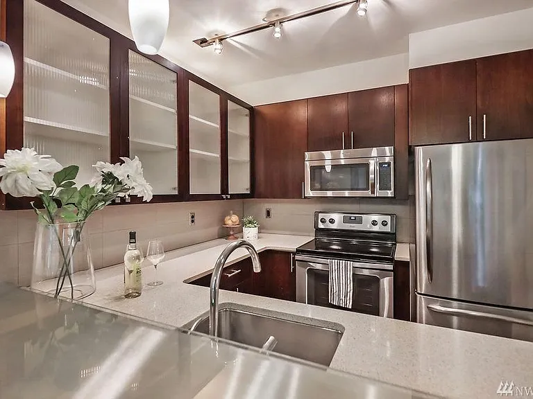 Beautiful kitchen with quartz countertops and stainless steel appliances