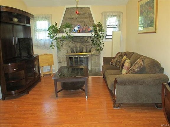 Living room with  stone fireplace
