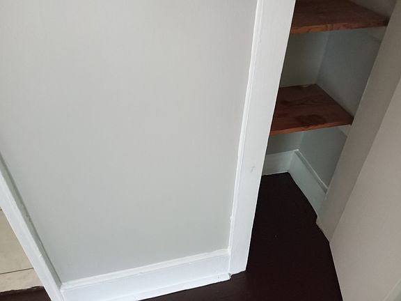 Hall Closet with shelves.