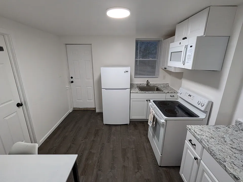 Kitchen facing front door.
