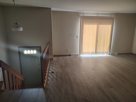 Livingroom with stairs to front door