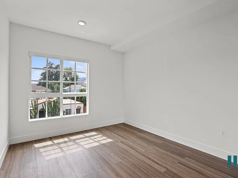 Bedroom with Large-Size Windows, Recessed Lighting, and Vinyl Flooring