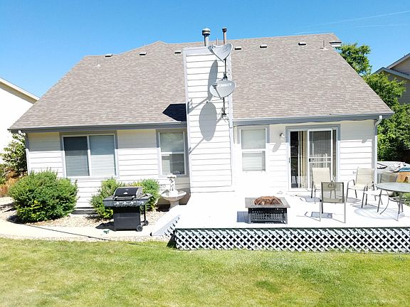 Back of Home. New Landscaping just Put in. Garden Box. Mature Trees.