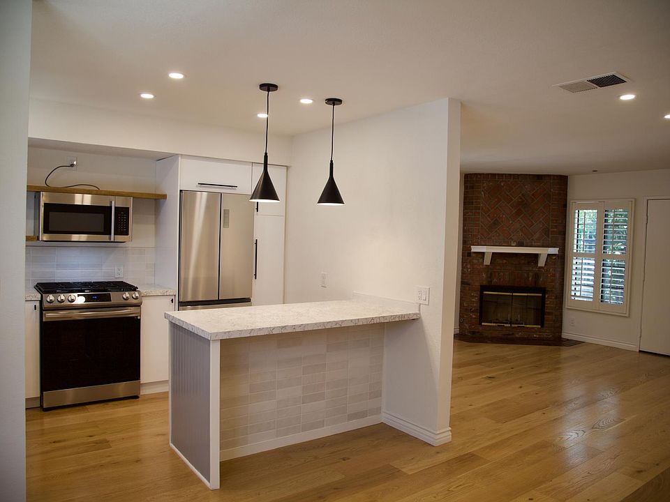 View from Dining area into Kitchen and Living Room